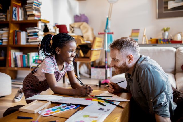 Dad coloring with daughter