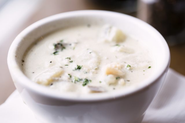Bowl of lightened up New England clam chowder.