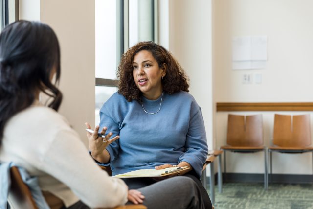 Two women discuss goals 