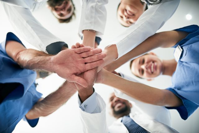 Care Staff putting their hands together