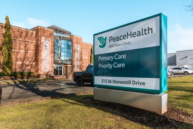 Exterior photo of PeaceHealth Mill Plain Clinic entrance and sign