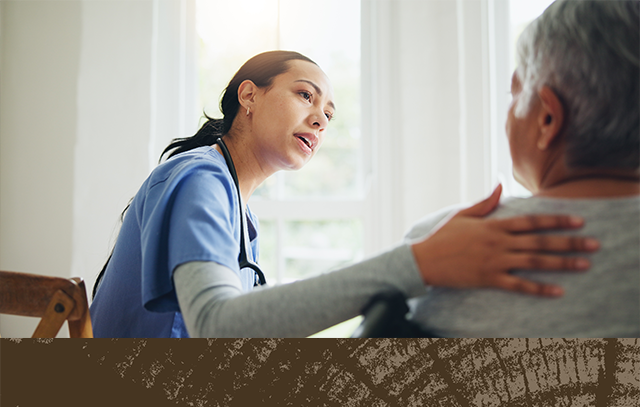 A nurse comforts a patient in a clinic setting