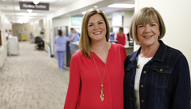 Kate Young and Kathy Corwin pose near the nurses station of Three North at PeaceHealth Southwest Medical Center in Vancouver
