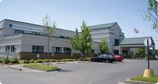 Photo of the Cordata building from the parking lot entrance