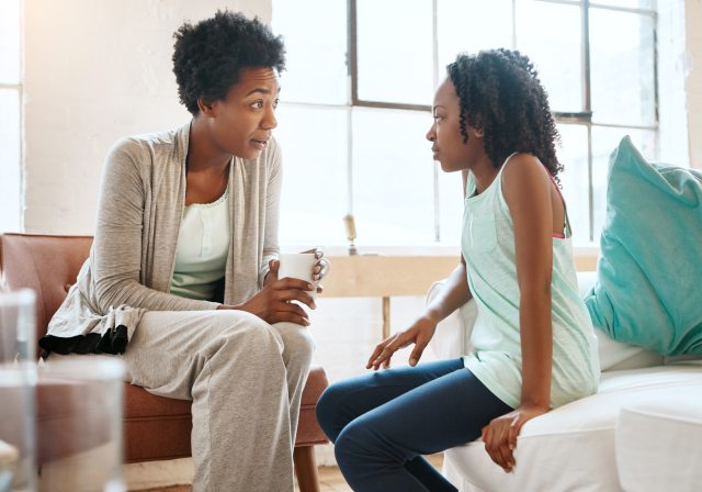 A woman and young teen have a discussion