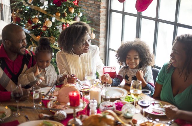 A smiling family enjoying a holiday meal together