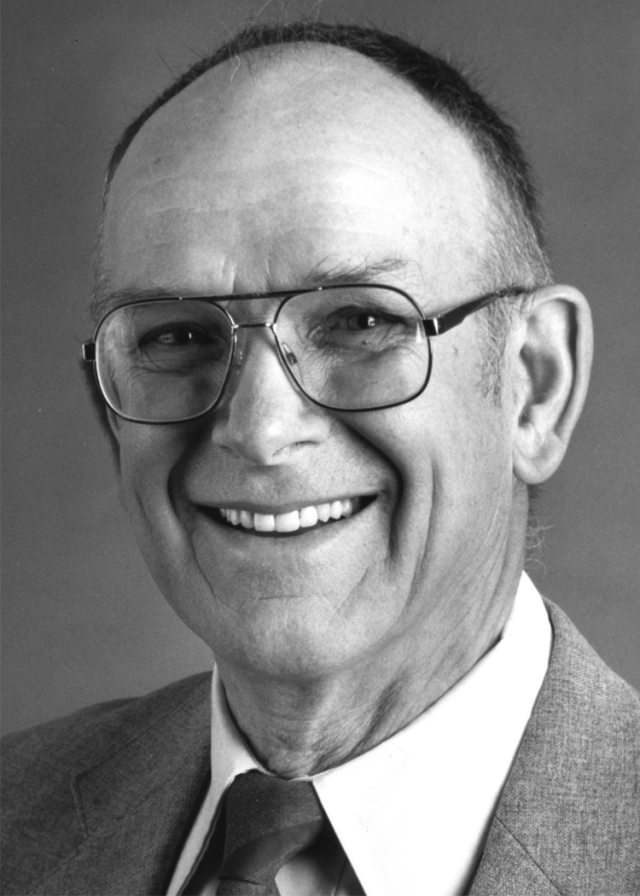 Portrait of a smiling man in black and white