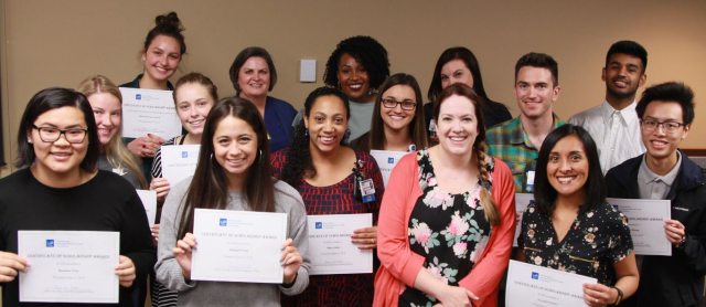 A group of Scholarship Winners hold their certificates