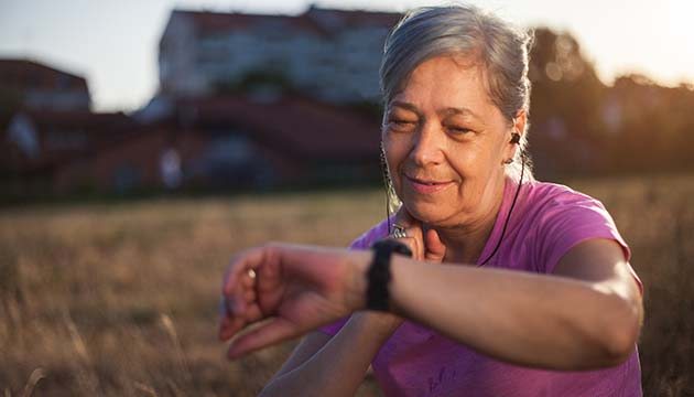 older woman checking her heart rate