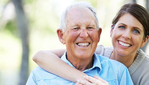 older man and young woman caregiver