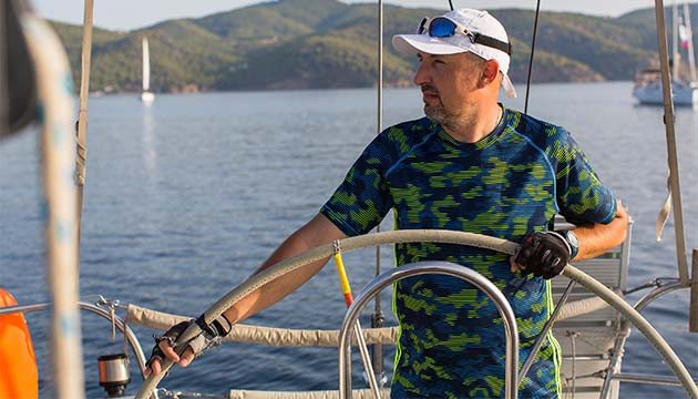 A man steering a boat