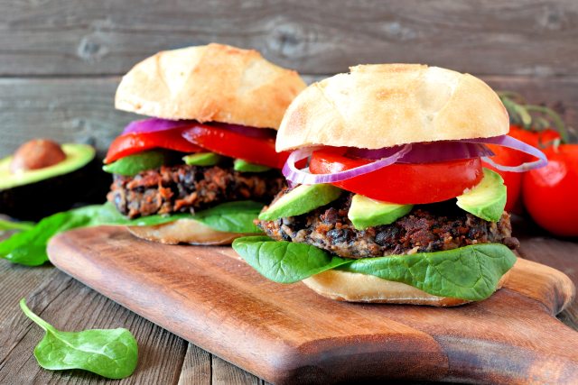 black bean burger with tomato, onion, lettuce and avocado