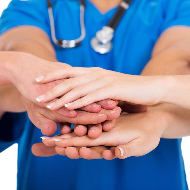 Nurses stacking hands