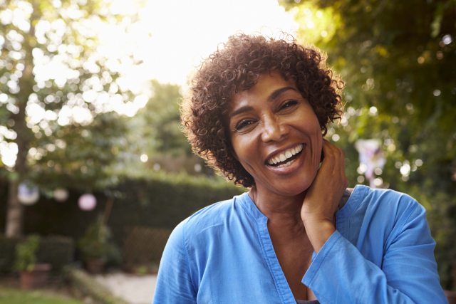 Woman smiling and looking at the camera