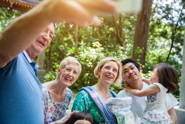 A group of family members smile for a photo