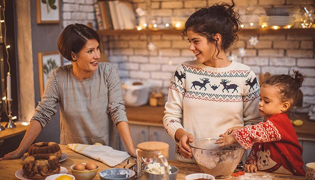 Mom and daughters baking for holidays