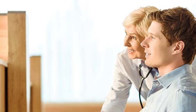 Provider and patient looking at something and being amused