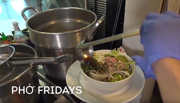 Khanh Tranh serves a bowl of pho, Vietnamese soup