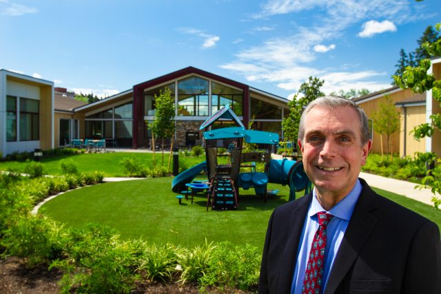 Ron Neumann of the Oregon Credit Union outside the Heartfelt House in Springfield, Oregon