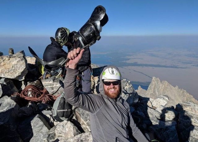 Jon happily waves his brace at the summit of Grand Teton