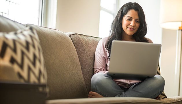 woman works on a laptop